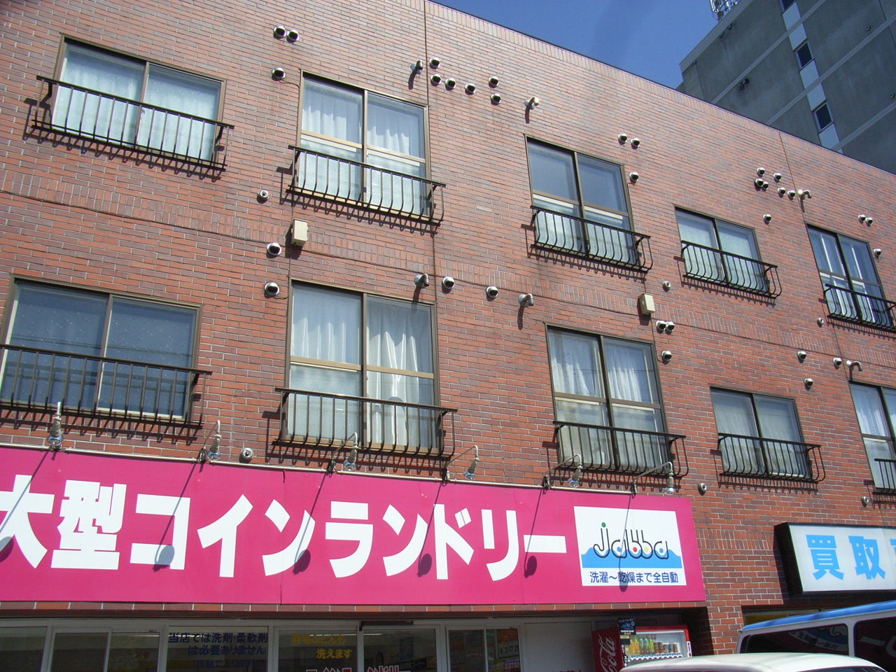 Building appearance. Coin-operated laundry on the first floor