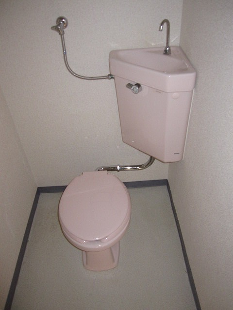 Toilet. Photos are separate in Room. 