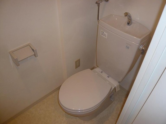 Toilet. It is spacious toilet. 