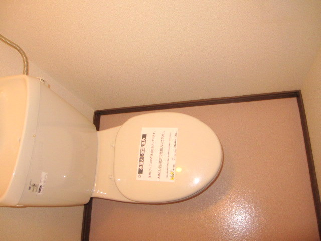 Toilet. Photos are separate in Room.