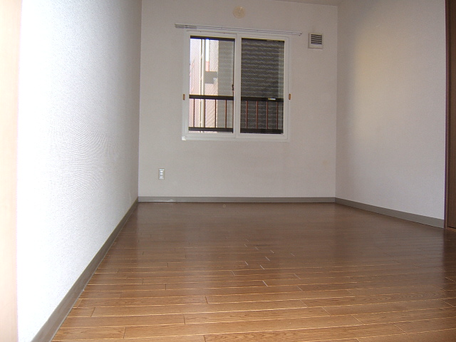 Other room space. The floor is vinyl flooring