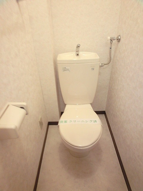 Toilet. Photos are separate in Room. 