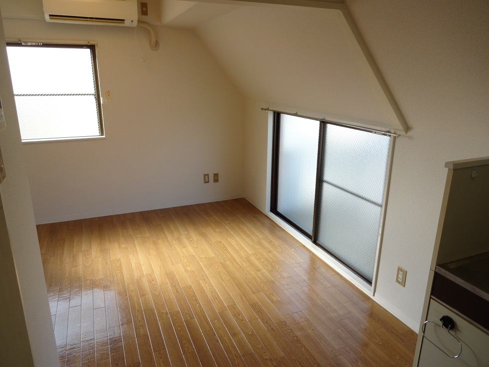 Living and room. It is a little unusual ceiling