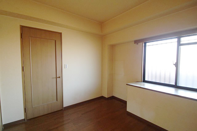 Living and room. It is a bright room with window