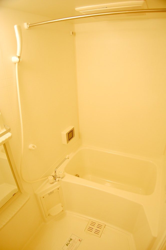 Bath. It is spacious and welcoming bathroom.
