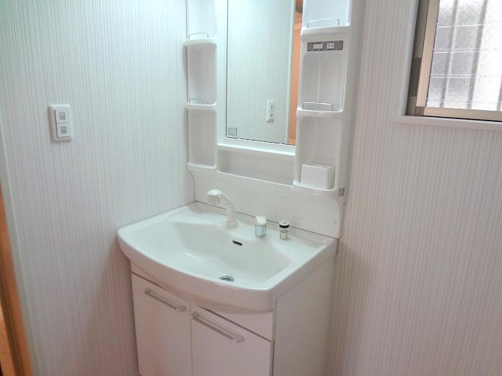 Wash basin, toilet. Shower nozzle, Vanity is vanity that also includes storage, etc.. 