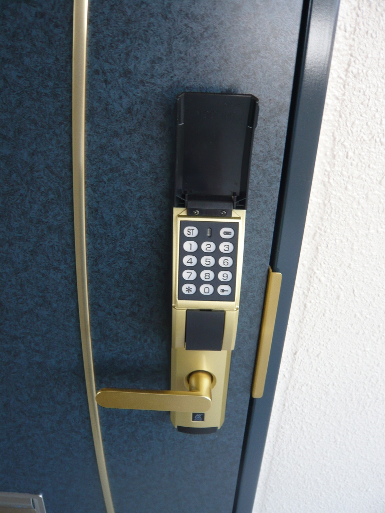 Entrance. Digital lock of the front door key to peace of mind