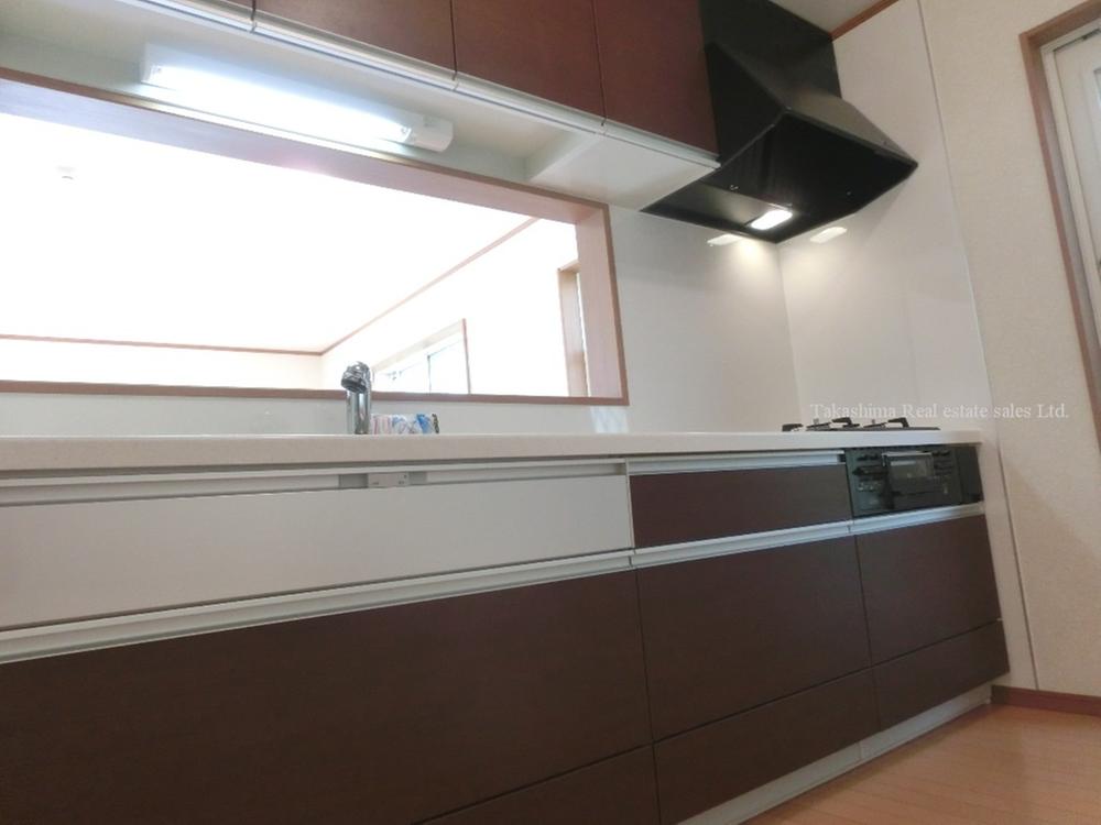 Kitchen. It is man-made marble top system Kitchen. It is with a water purifier.  [Example of construction] 