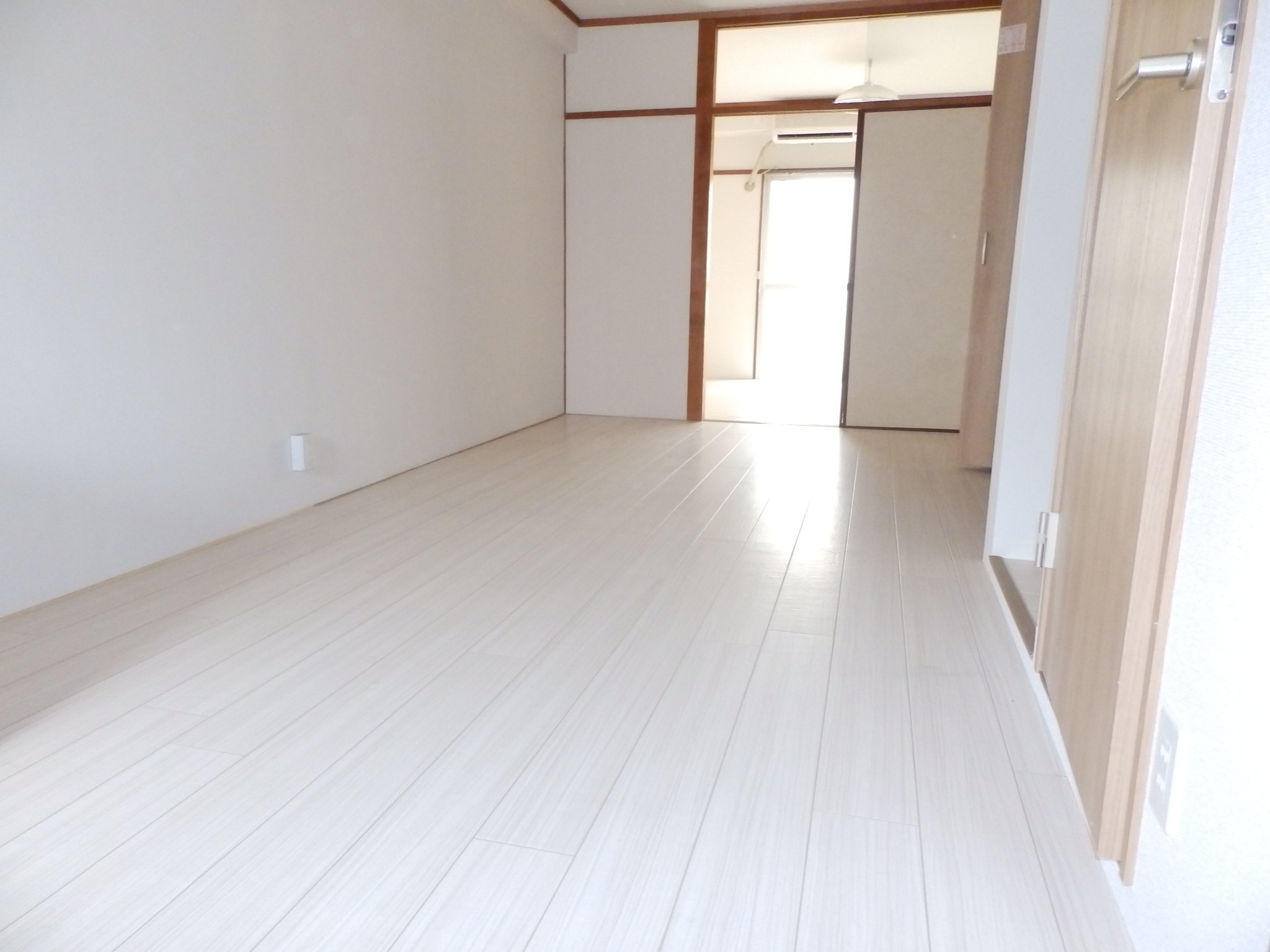 Living and room. It is a white flooring
