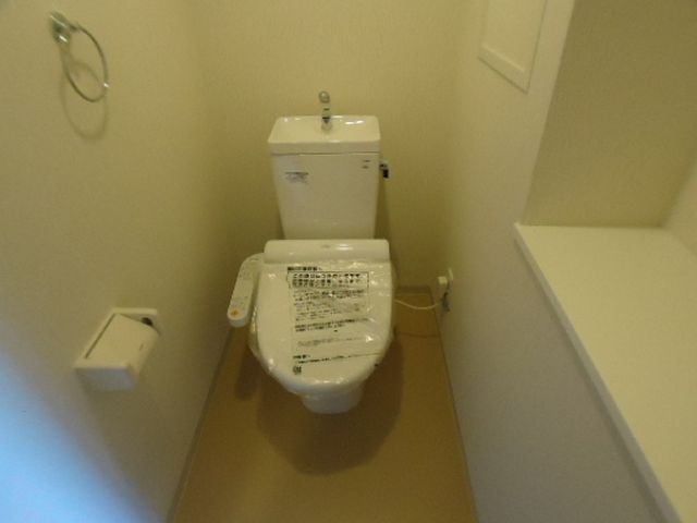 Toilet. Washlet installation completed. There is also a shelf.