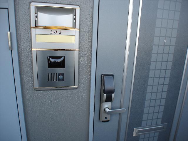 Security. Monitor intercom and digital lock on the front door