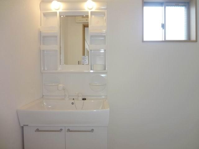 Wash basin, toilet. 2nd floor powder room. Shampoo dresser. 
