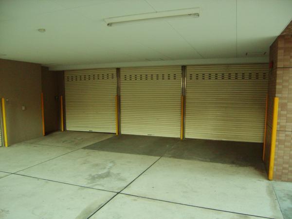 Parking lot. Shuttered garage