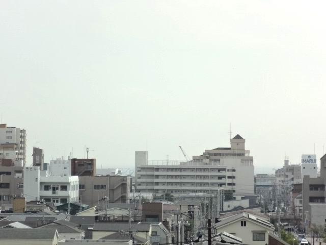 View photos from the dwelling unit. View from the south balcony. The sea is visible in the distance.