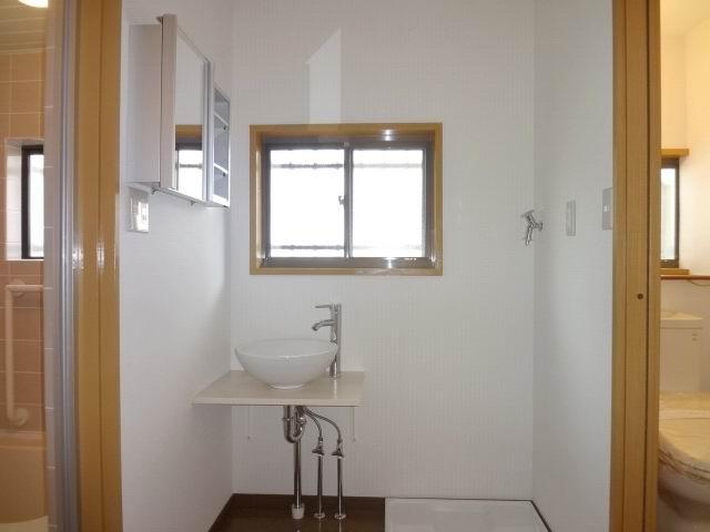 Wash basin, toilet. First floor powder room. Cross stuck Kawasumi. Vanity is installed already.