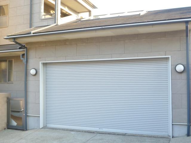 Parking lot. Electric shutter with garage