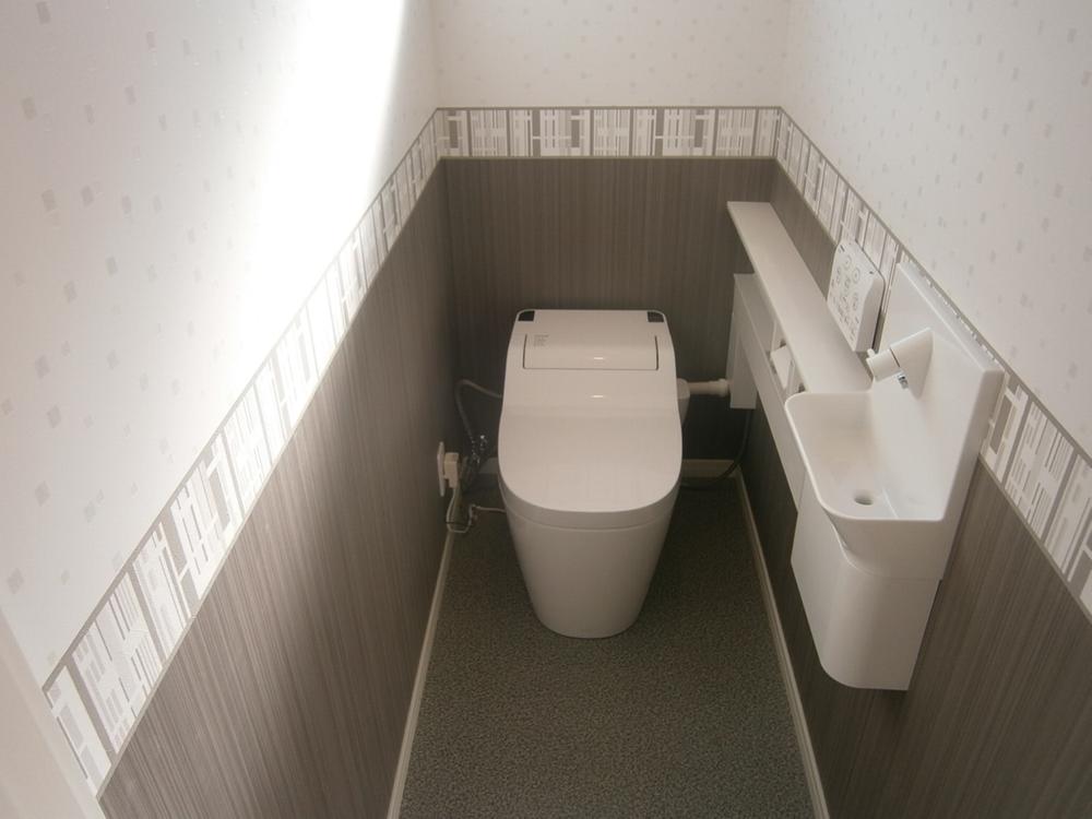 Toilet. Tankless toilet is available clean spacious use