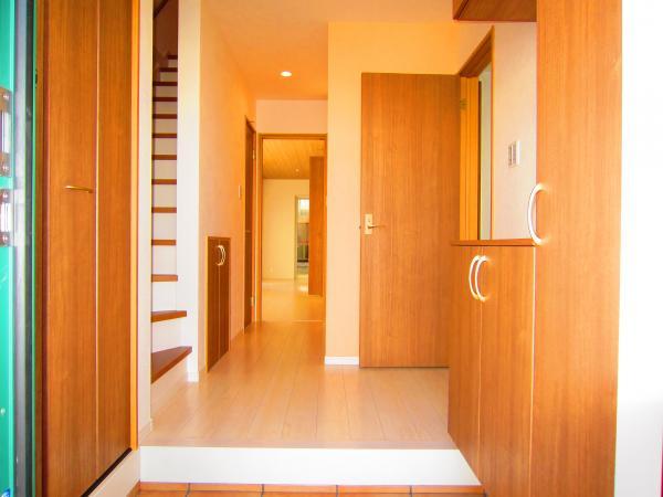 Entrance. Cupboard and shoes with a cloak in bright entrance