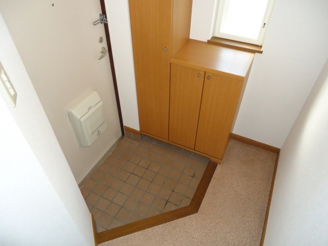 Entrance. It is with cupboard.