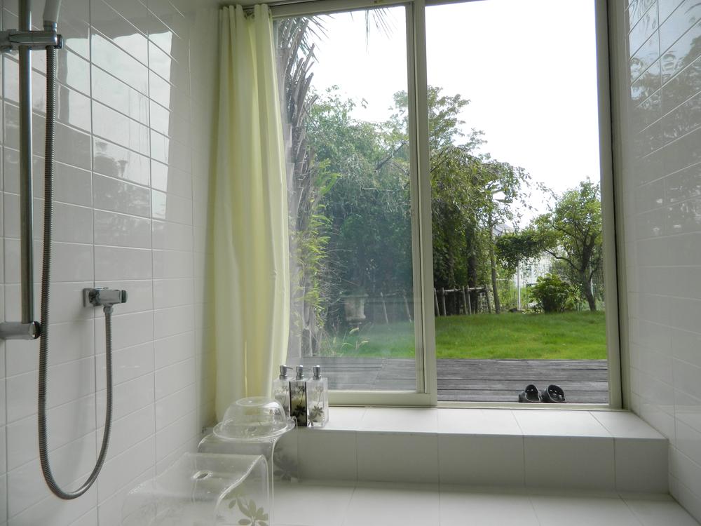 Bathroom. The view from the bathroom, terrace, You can enter and exit to a private garden. Ventilation of the bathroom is outstanding