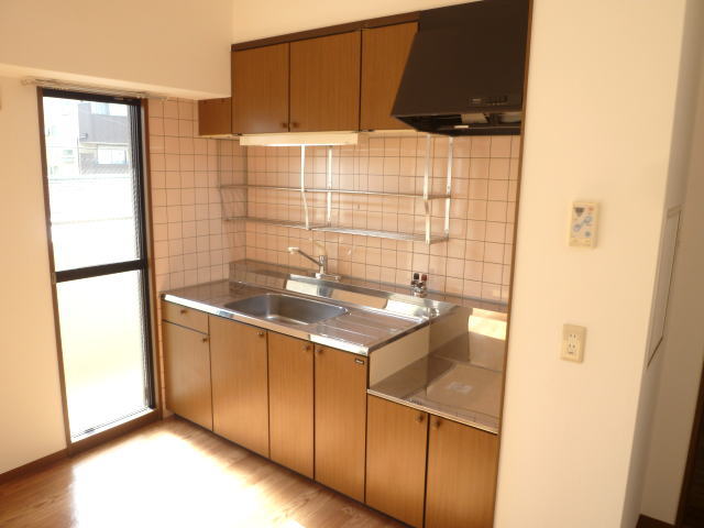 Kitchen. There is a back door is convenient