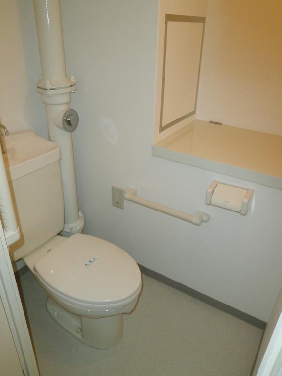 Toilet. Toilet space provided with a counter (upstairs)