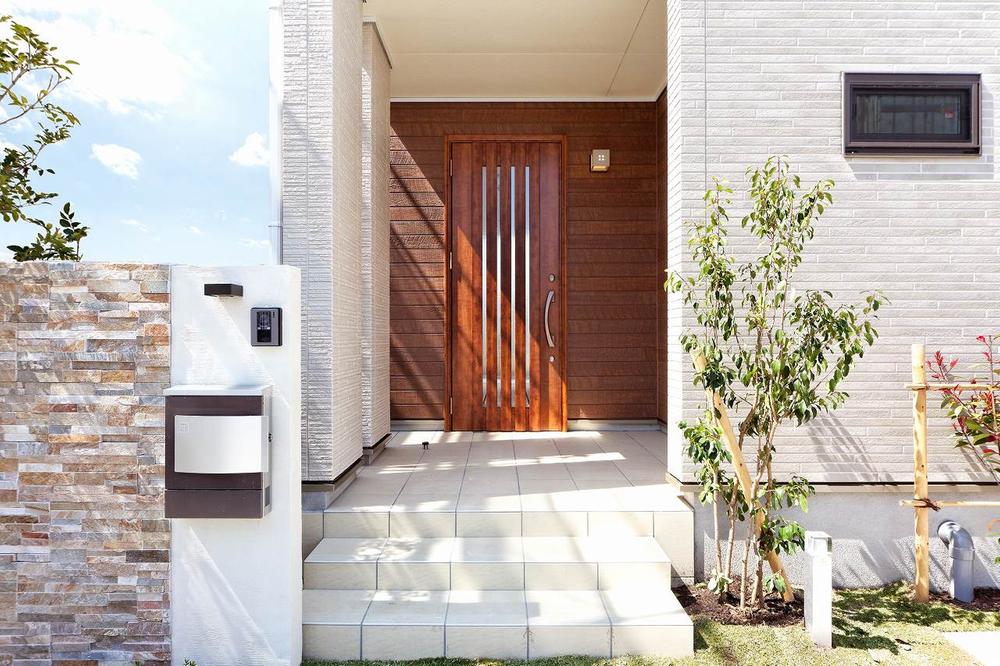 Entrance. It is fun to go home everyday, Such entrance and planting will greet.