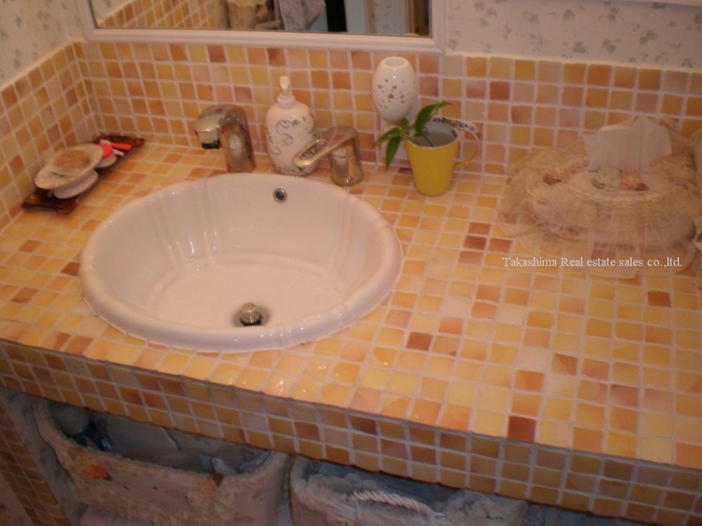 Wash basin, toilet. Wash basin also tiled commitment.
