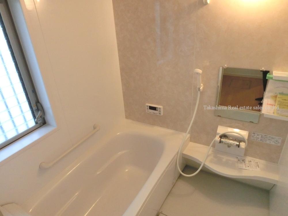 Bathroom. In the bathroom drying heater with system bus is there is a big window.