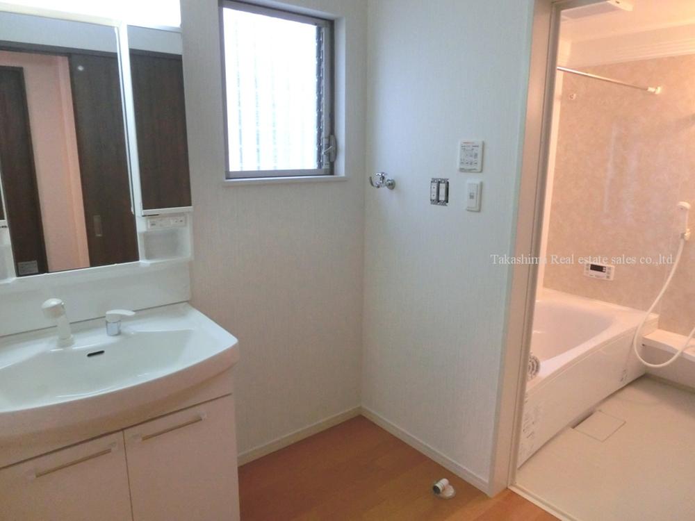 Wash basin, toilet. Is a washroom and bathroom.