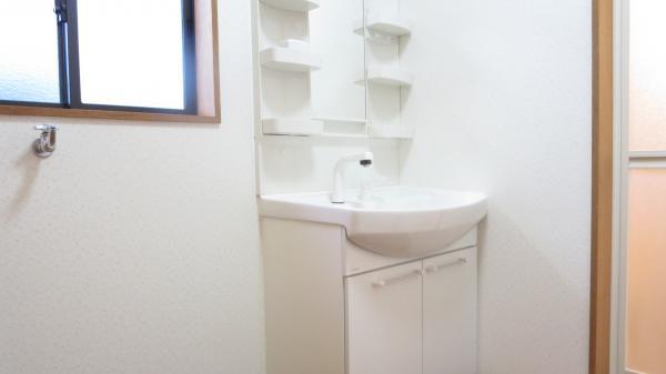 Wash basin, toilet. Bright laundry undressing space