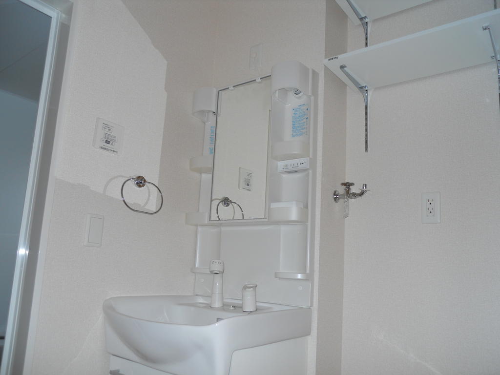 Washroom. Also nice compact in shower. Convenient shelf on top of the washing machine yard