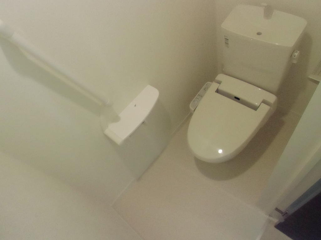 Toilet. handrail, window, Washlet is with This cozy toilet