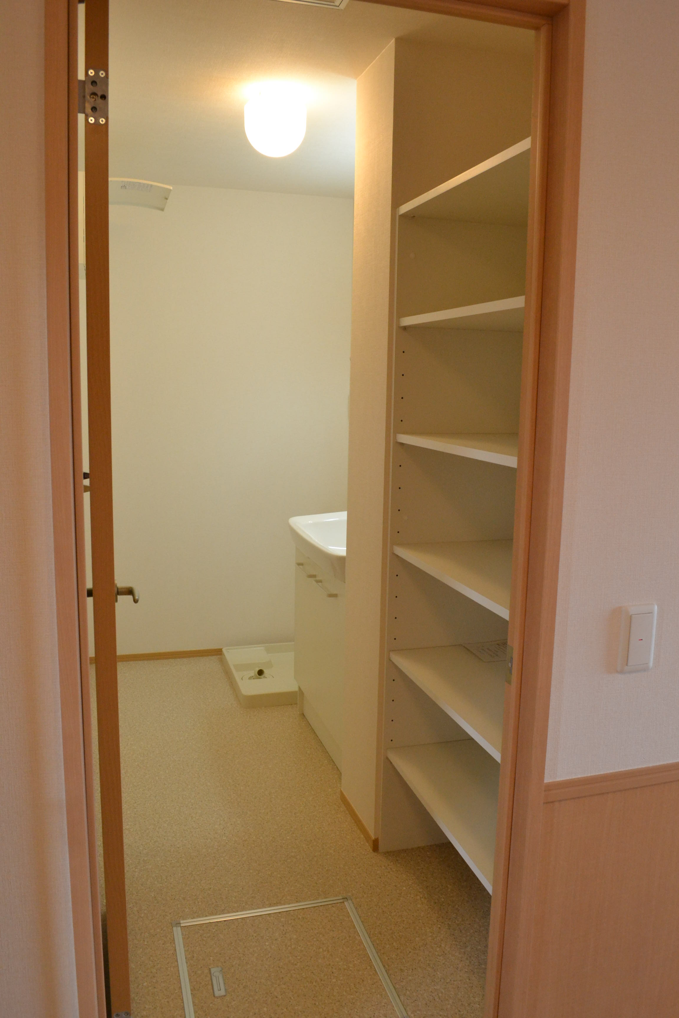 Washroom. Basin with storage shelves