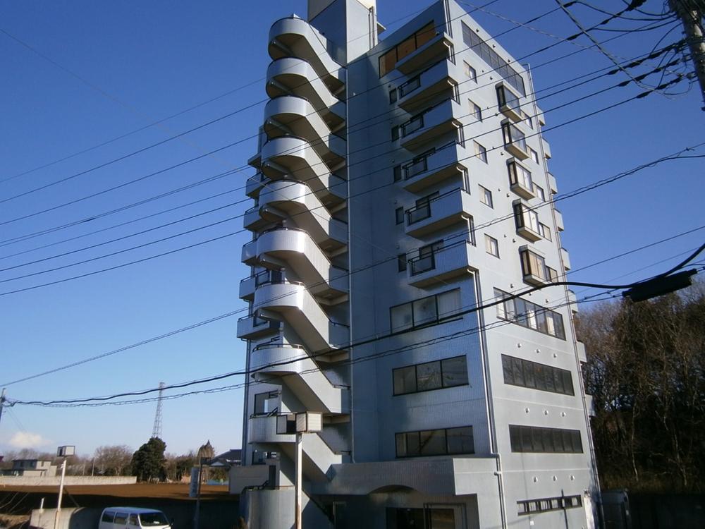 Local appearance photo. 10-story apartment tower along the Country line!