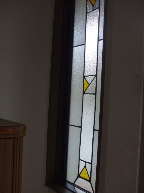 Entrance. Stained glass expansion of the entrance door aside.