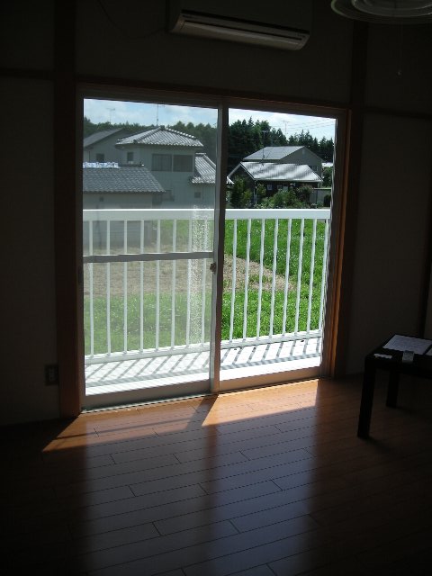 Living and room. The photograph is an image of another room.