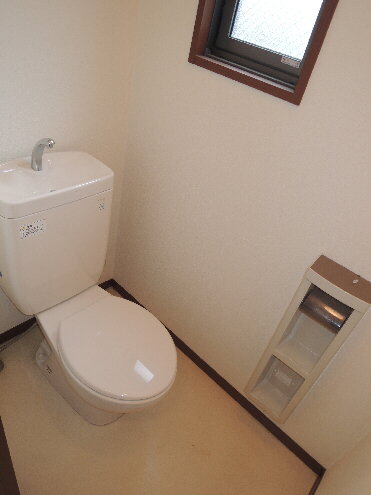 Toilet. Small window with! 