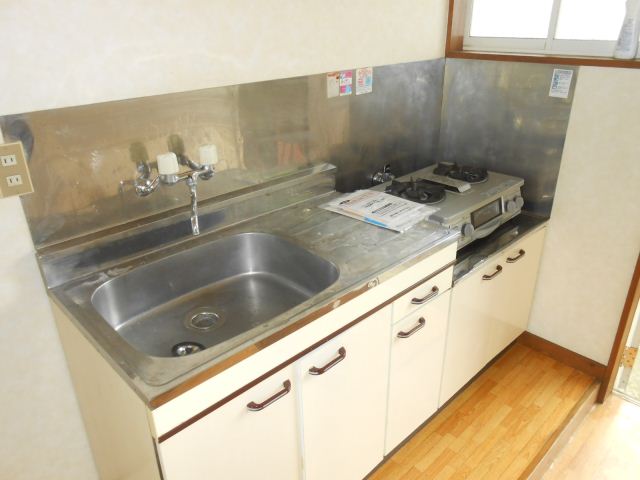 Kitchen. There is a window in the side ventilation easy spacious kitchen