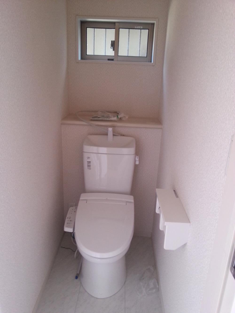 Toilet. 1F toilet (warm water cleaning toilet seat)