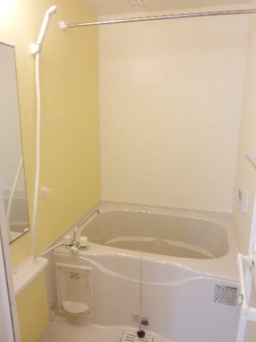Bath. Stylish space with yellow accent panel
