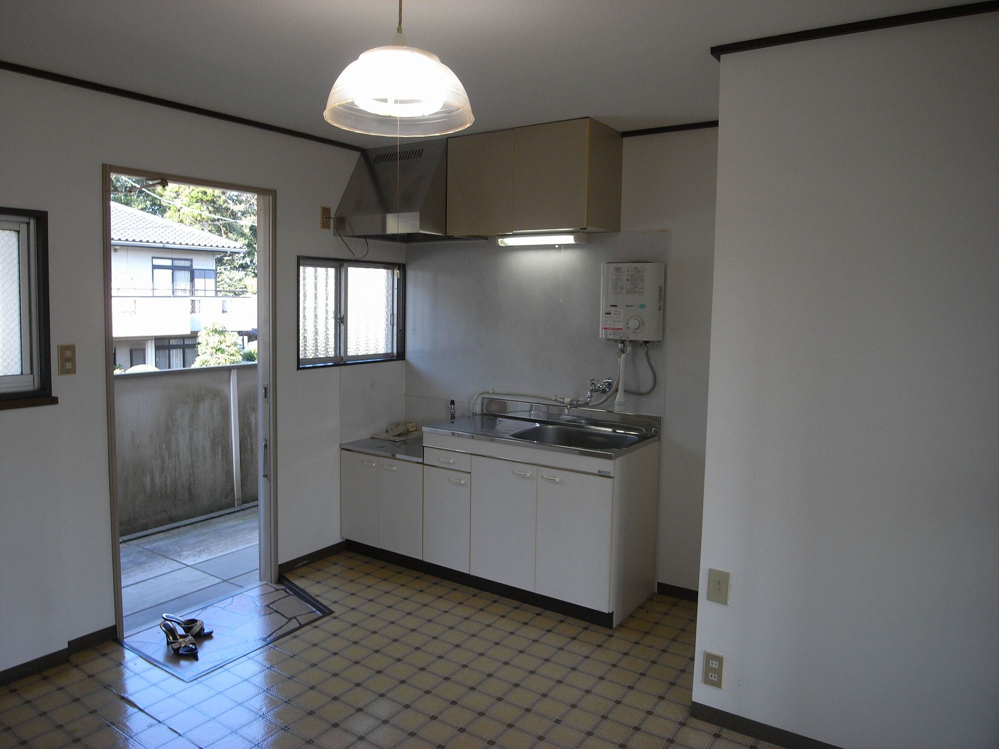 Kitchen. The kitchen is bright because there is a window ~
