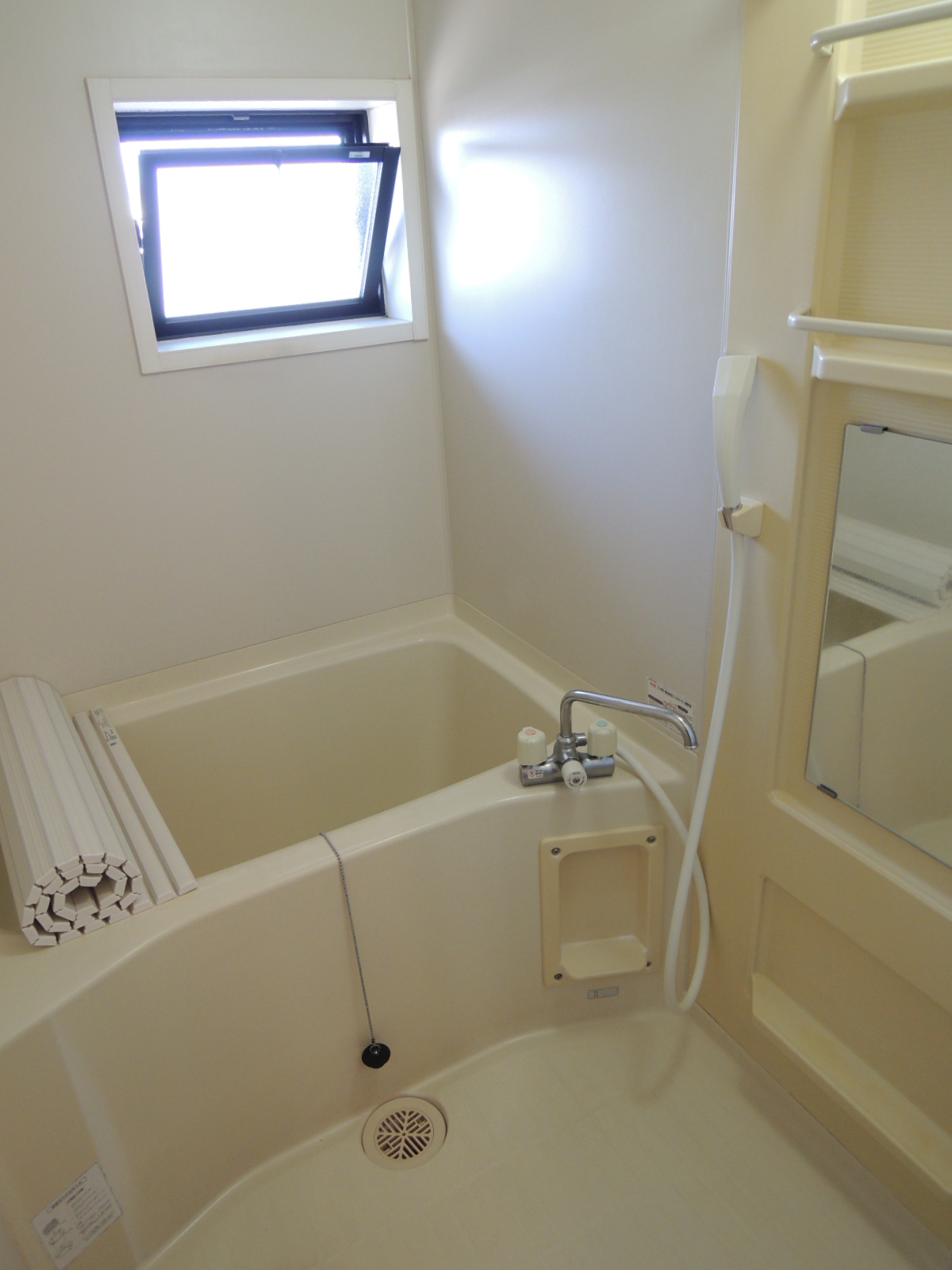 Bath. There is a window in the bathroom