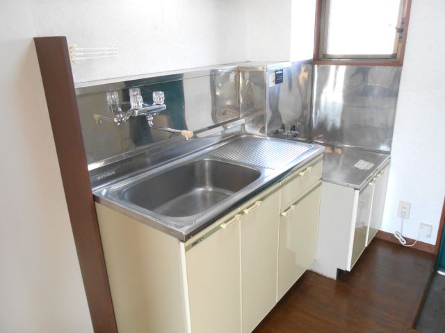 Kitchen. Bright kitchen has a window aside. 