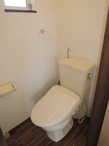 Toilet. With warm water washing toilet seat!