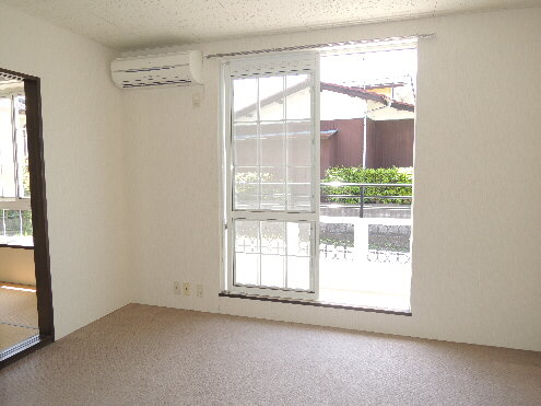 Living and room. Sunlight plenty with large windows!