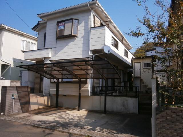 Parking lot. Garage with carport