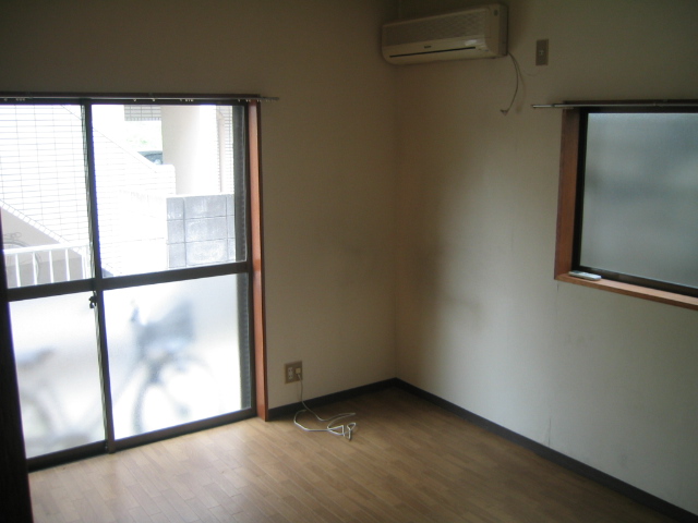 Living and room. There is a two-sided window in the corner room