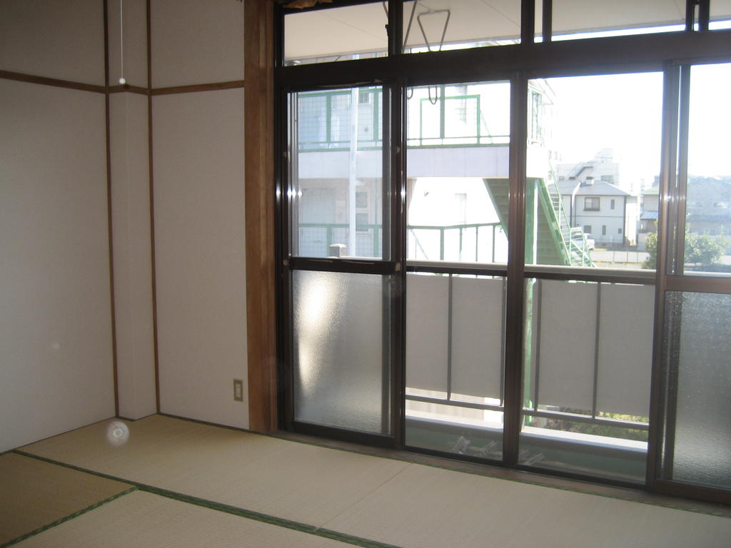 Other room space. A bright room with large windows