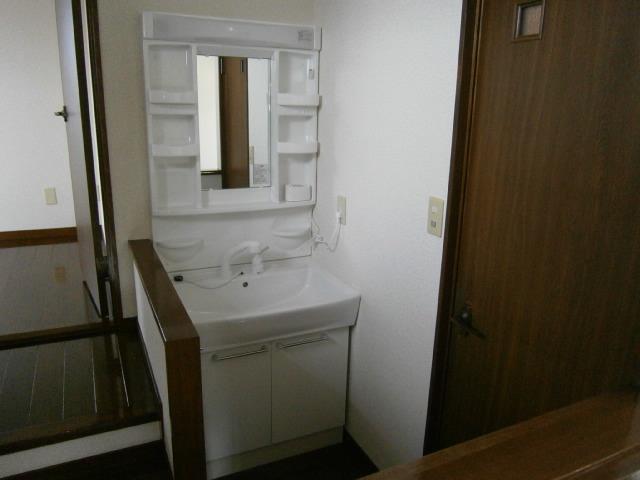 Wash basin, toilet. The third floor wash basin is brand new! 